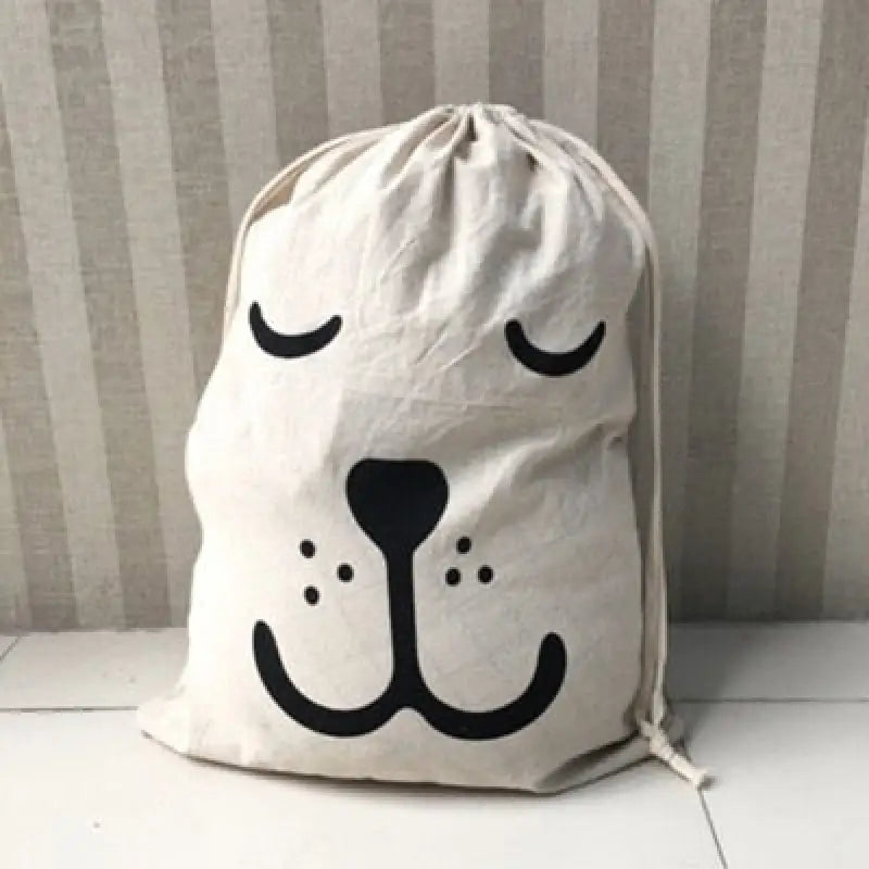 a white bag with a black face on it