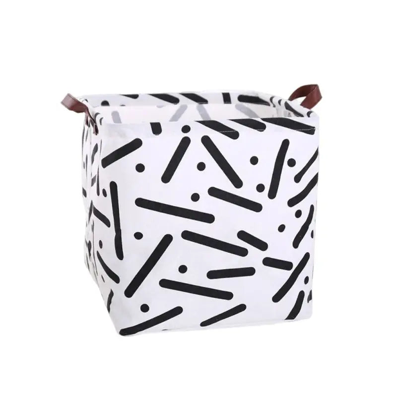 the white and black geometric pattern on this storage bag is perfect for storing items