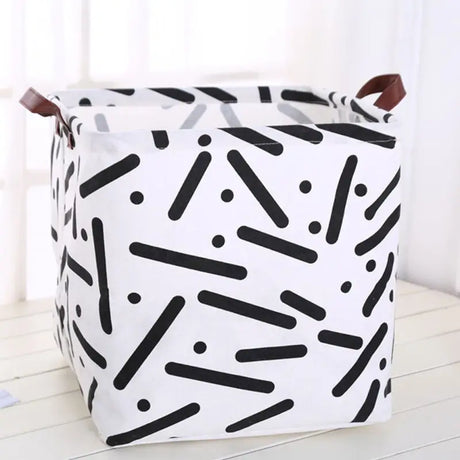 a white and black storage bag with a pattern on it