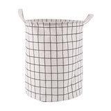 the white and black plaid laundry basket is shown with a black and white check pattern