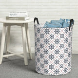 a white and black laundry basket with a pattern on it