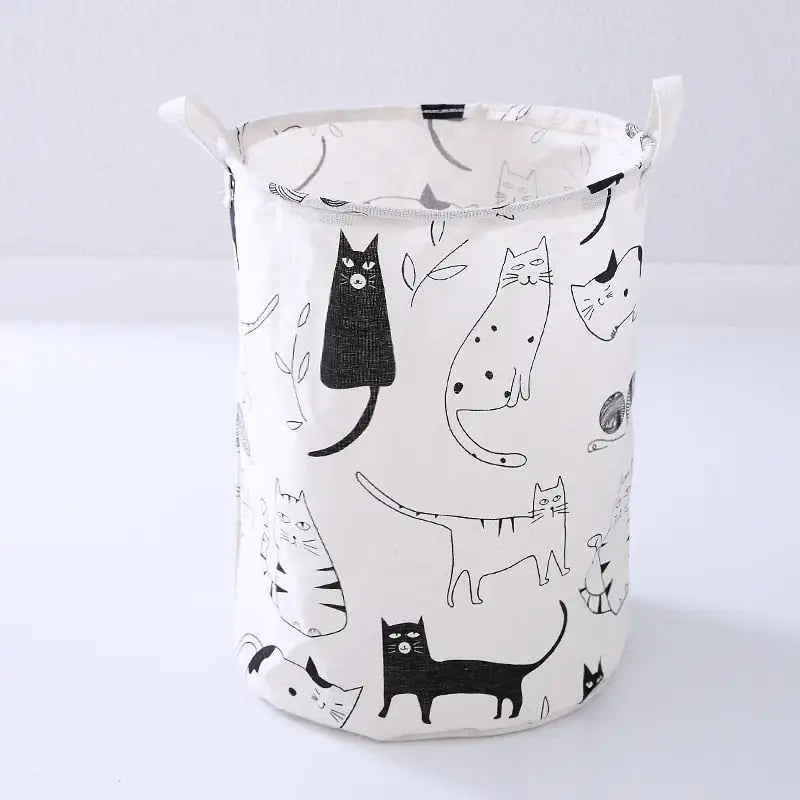 a white and black cat laundry bag with a black cat pattern
