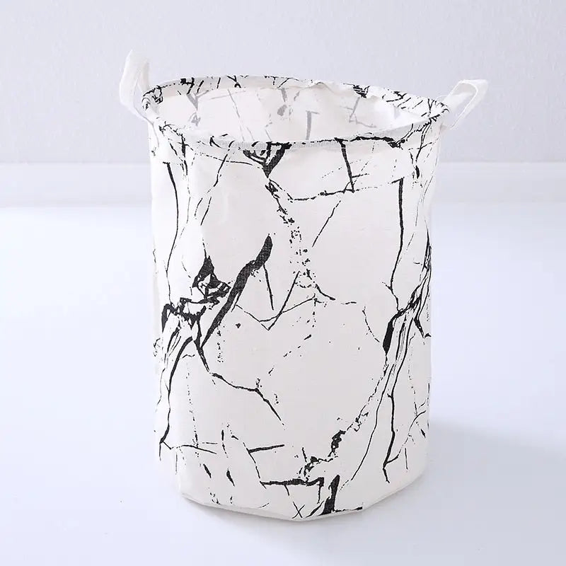 a white and black marble bucket with handles