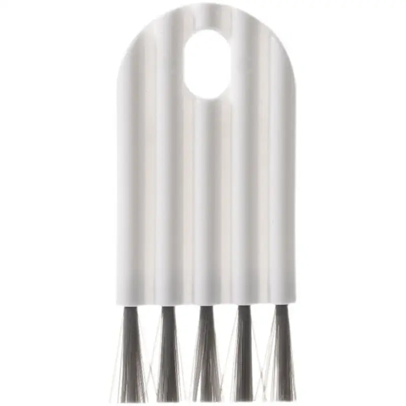 a white and black metal object with three metal spikes