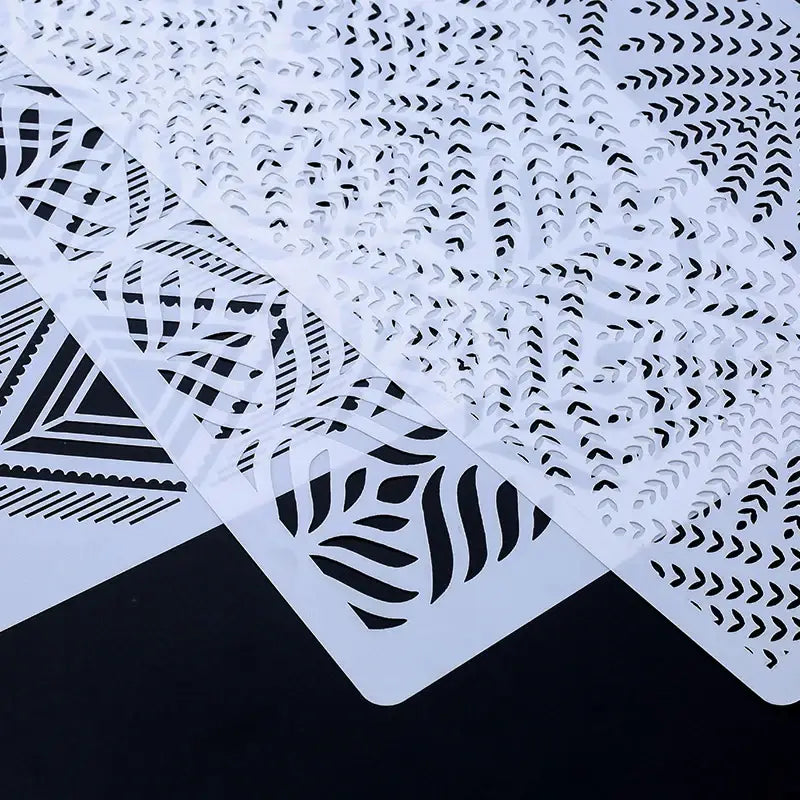 a white and black paper cut out of a pattern
