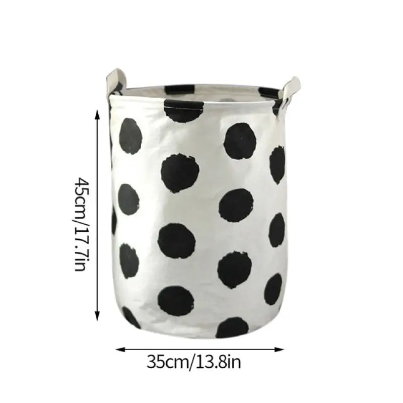 the black and white polka dot pattern on this small pot is a great addition to any home decor