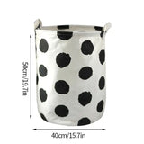 a close up of a white and black polka dot storage bin
