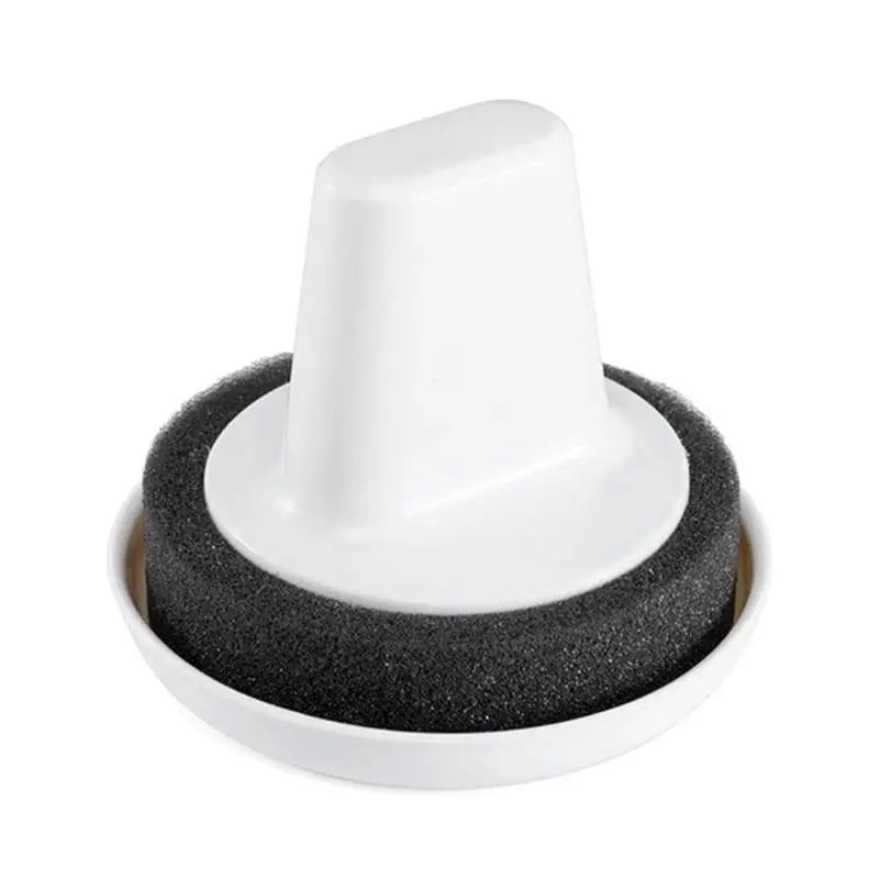 a white cup with black foam on top