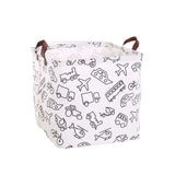 the white and black toy storage bag with a pattern of toys