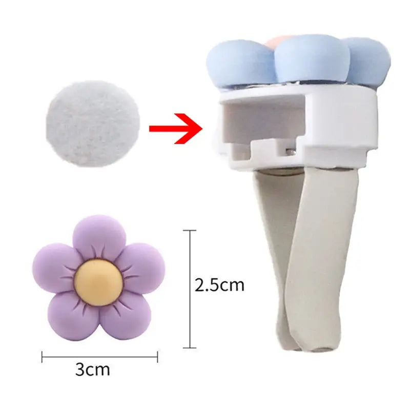 a white and blue flower shaped object with a white handle