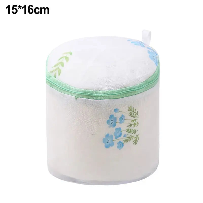 a white plastic container with blue flowers on it