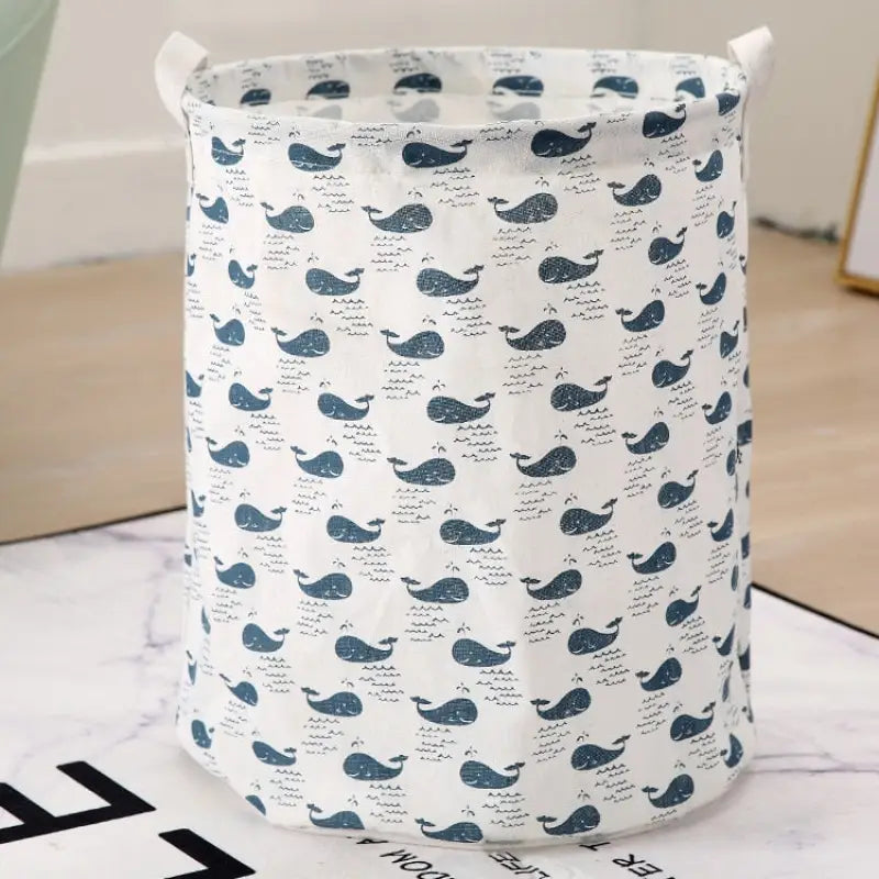 a blue whale laundry bag on a white marble table