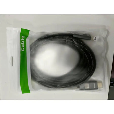 A white box with a black and green cable