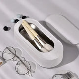 a white box with glasses and a pair of glasses