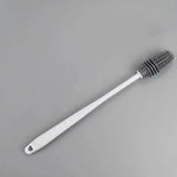 a white toothbrush on a gray background