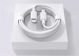 White charging cable coiled on a square base with USB-C and Lightning connectors visible.