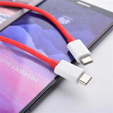 a red and white usb cable connected to an iphone