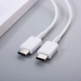 two white usb cables connected to a laptop computer