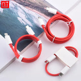 two red and white cables connected to a white charger