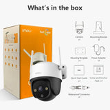 a white camera with a box and instructions