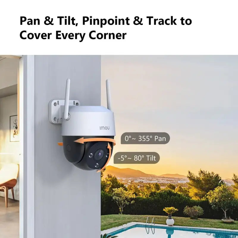 A white camera mounted on the side of a house