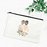 a white canvas bag with a watercolor illustration of a bride and groom