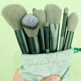 a person holding a bag with makeup brushes