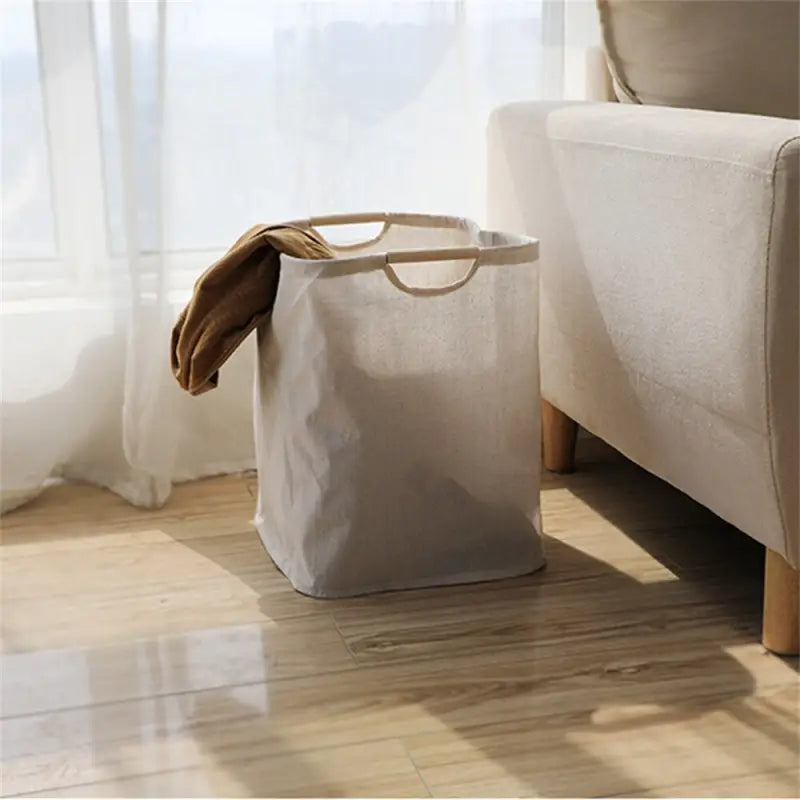 a white chair with a beige bag on it