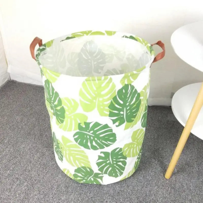 a white chair and a green and white plant pot