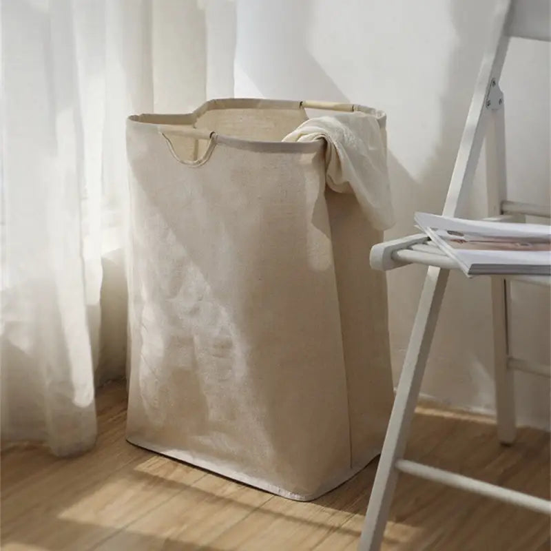 a white chair and a large bag on the floor
