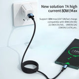 a white wall charger with a black cord