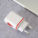 a white and red usb charger on a gray surface