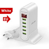 a white charger with a red and green charging plug