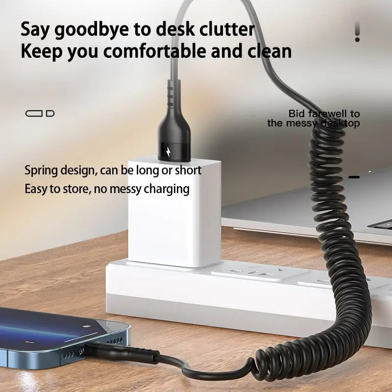 a phone charging station with a phone and a laptop