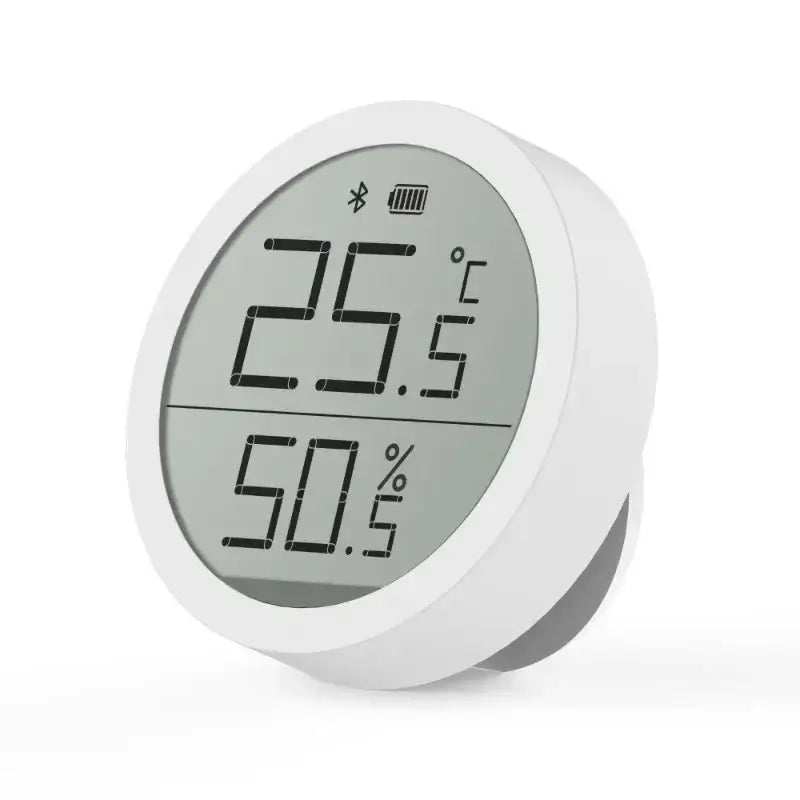 a white clock with a digital display