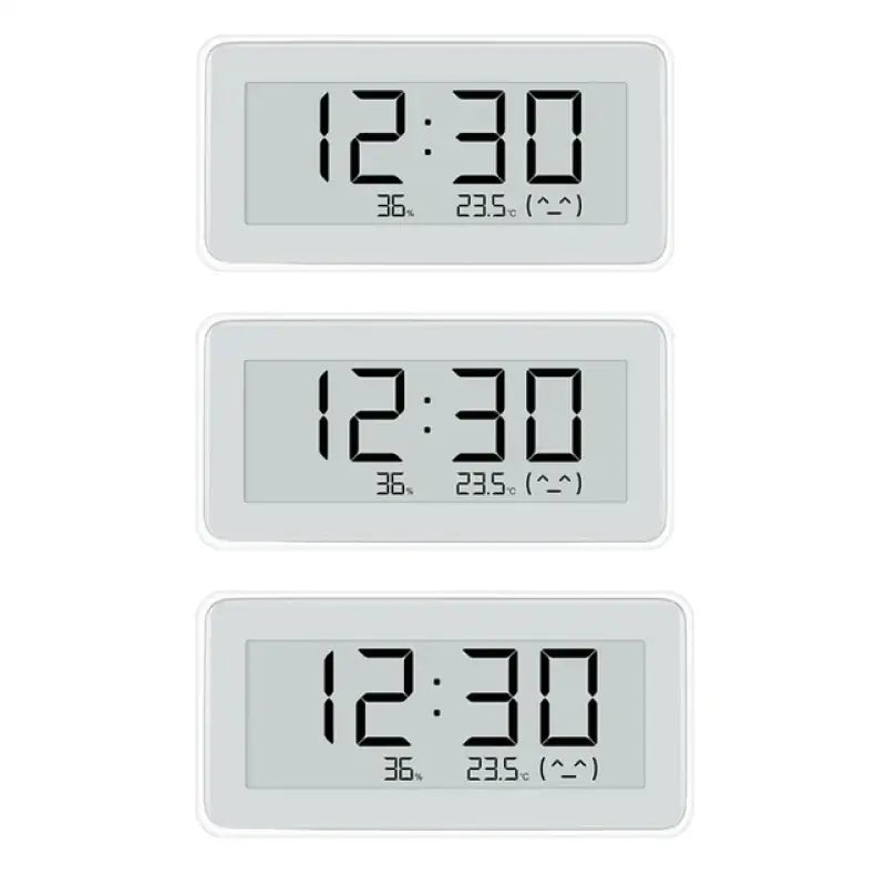 A white clock with three different times