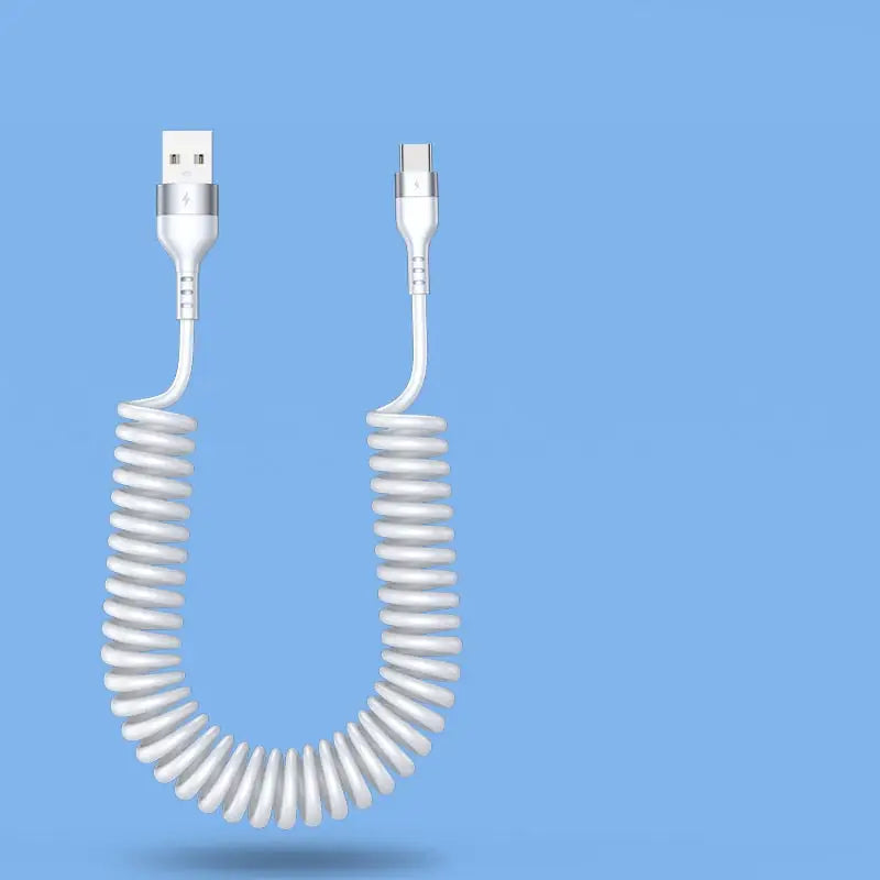 a white coiled cable connected to a white phone