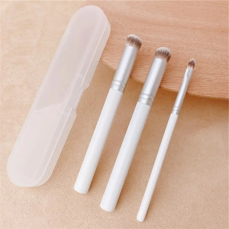 three brushes in a white box