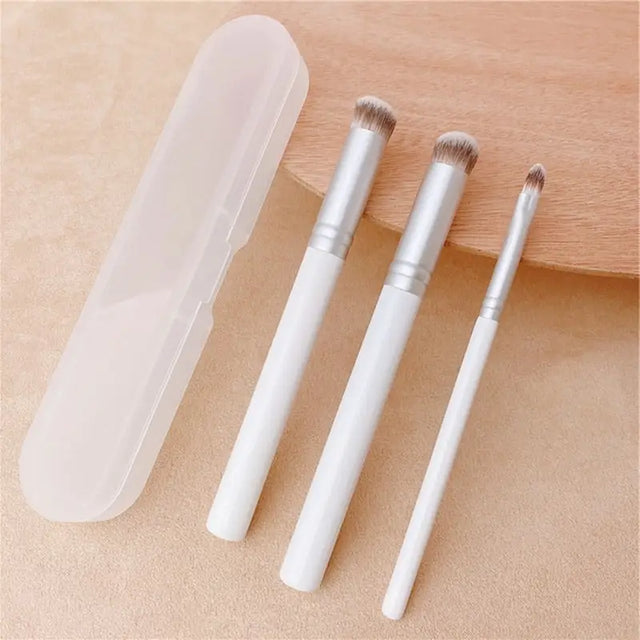 three brushes in a white box