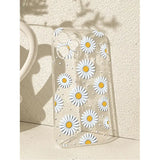 there is a clear case with daisies on it sitting on a table