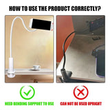a white desk lamp with a black and red light