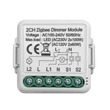 A white dimmer module with green wires and a white background