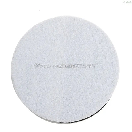 a white disc with the words’’’on it