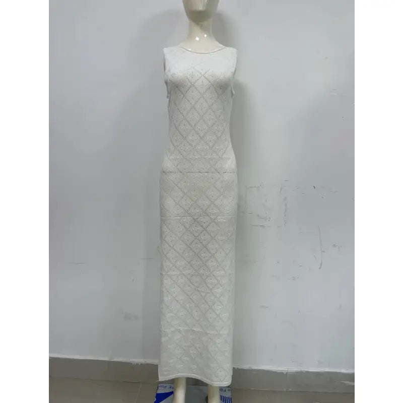 a mannequin dress with a white dress on a mannequin stand