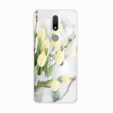 a white flower phone case with a photo of a yellow tulip