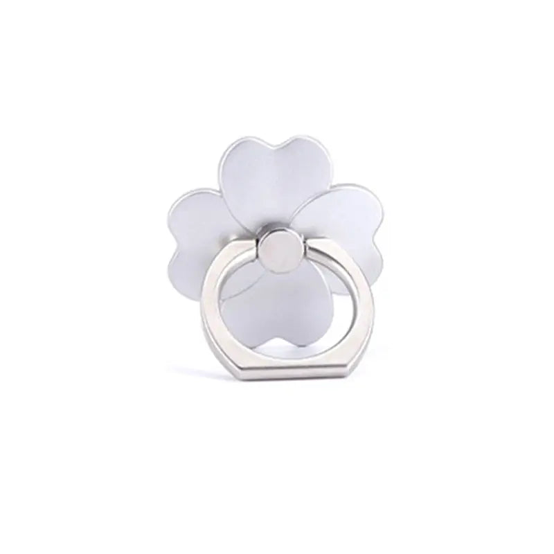 a white flower ring with a silver band