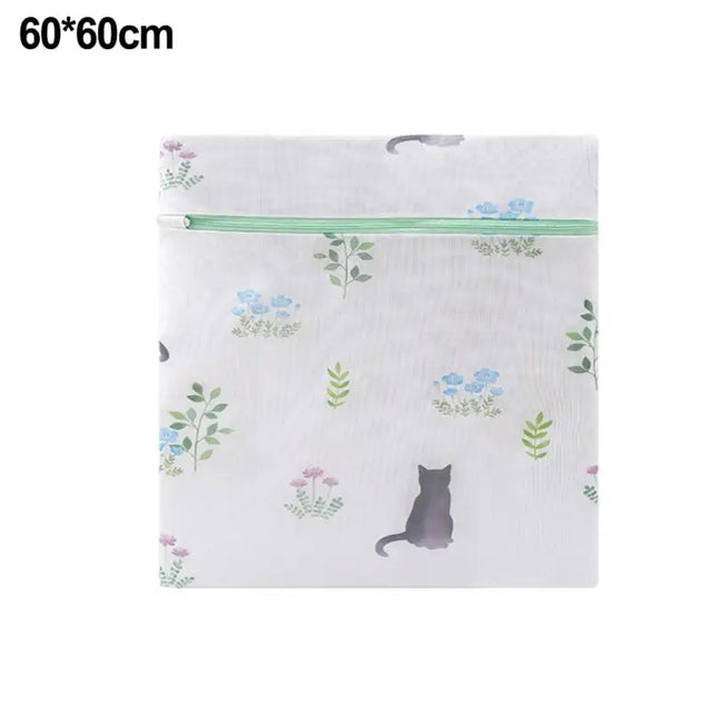 a white bag with a cat and flowers on it