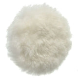 a white fluffy ball on a white background