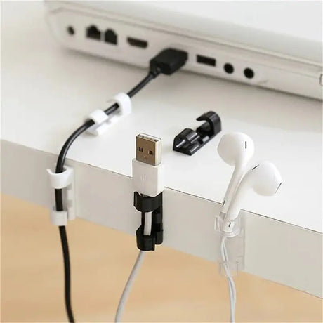 a white table with a white table top and a black cable connected to the side of the table