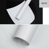 a roll of white paper on a black background